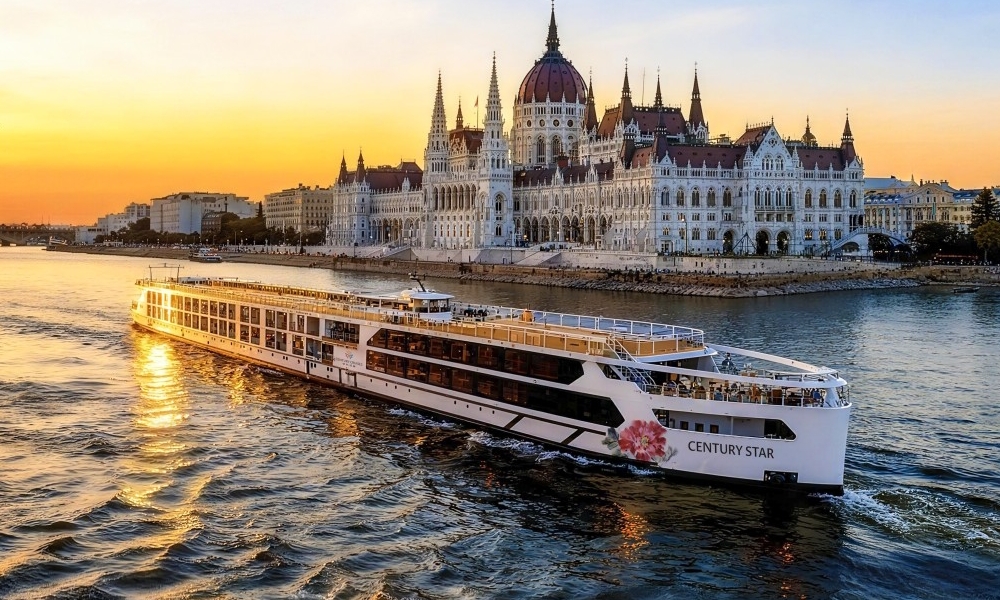 Century Star river cruise ship sailing past the Hungarian Parliament in Budapest