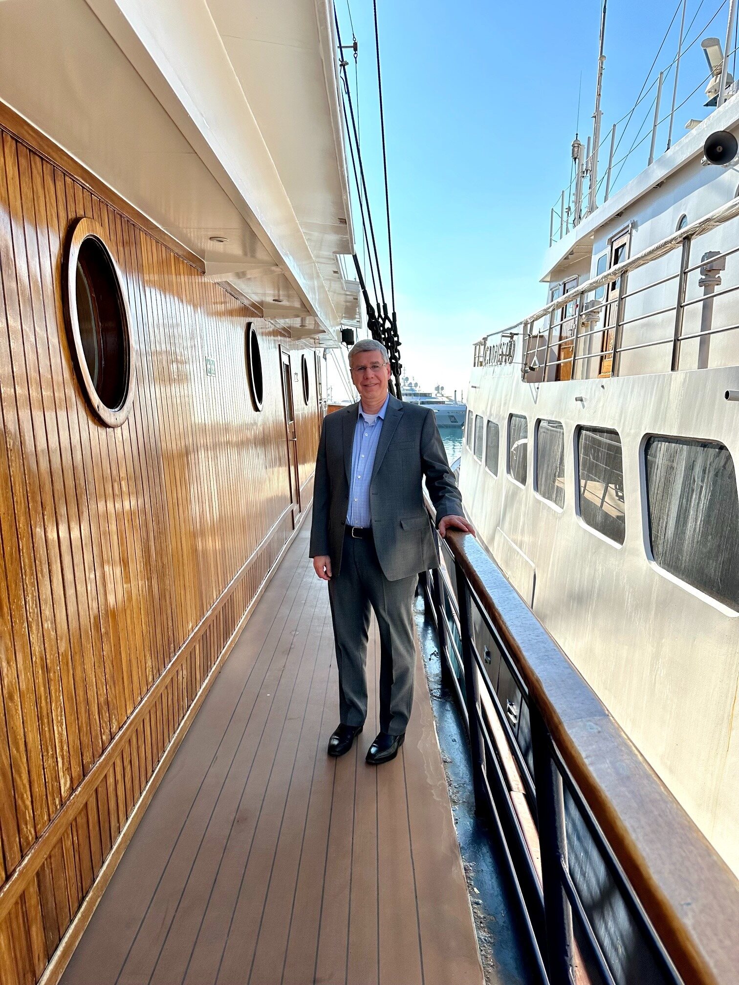 Steve walking the deck of a small cruise ship
