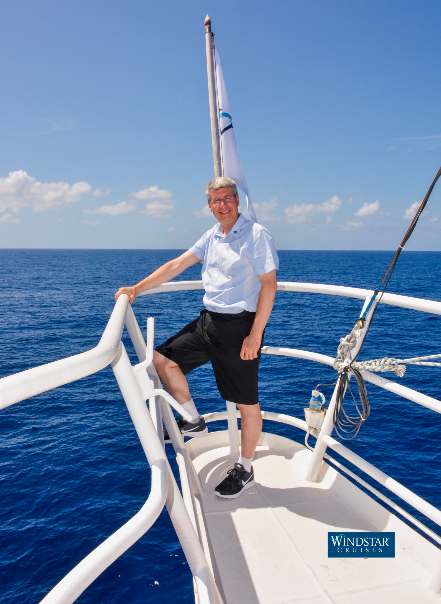 Steve at the bow of a Windstar small ship