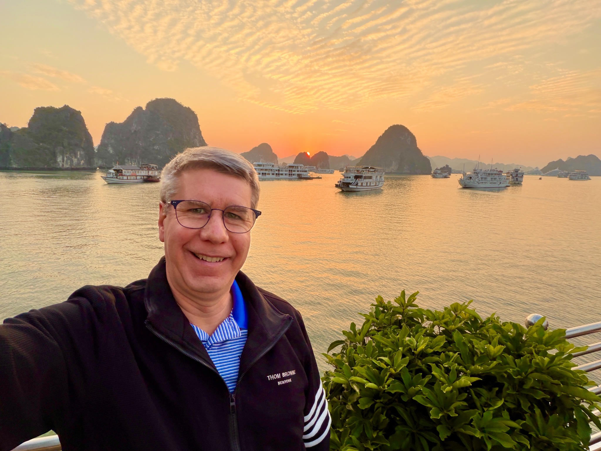 Steve traveling through a dramatic waterside landscape in Asia