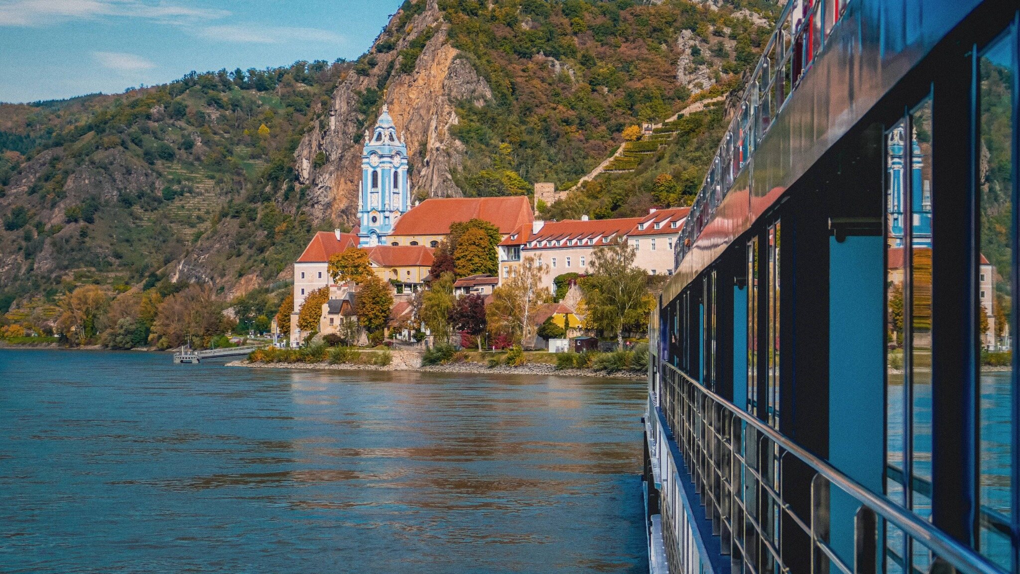 Dürnstein and its riverside church seen from a river ship on the Danube